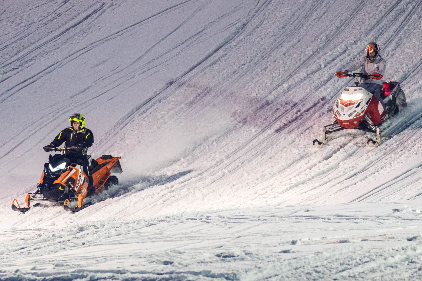 Snowmobile races heat up the night